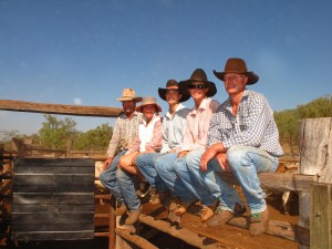 French family sitting on rails